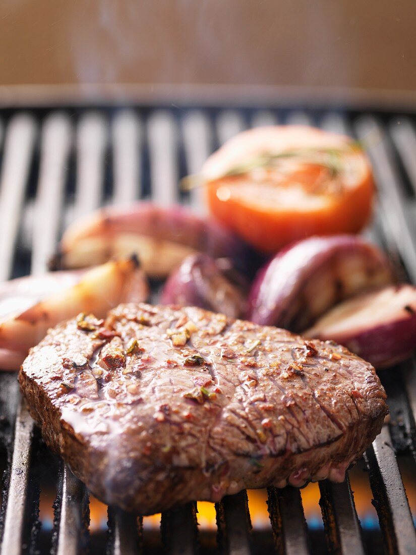 Barbecued beef steak on the barbecue