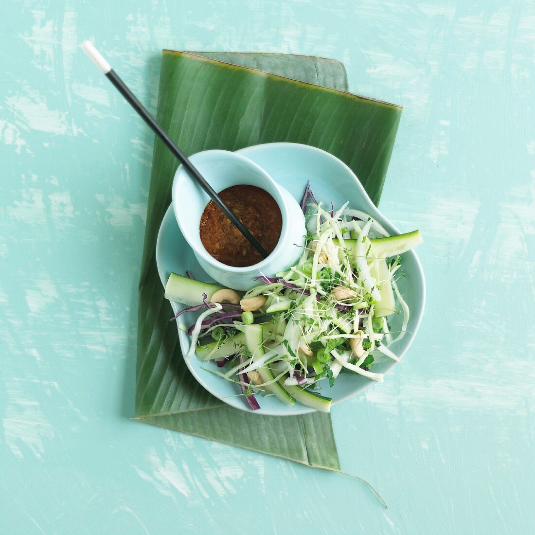 Asian cabbage salad with white and red cabbage and zucchini