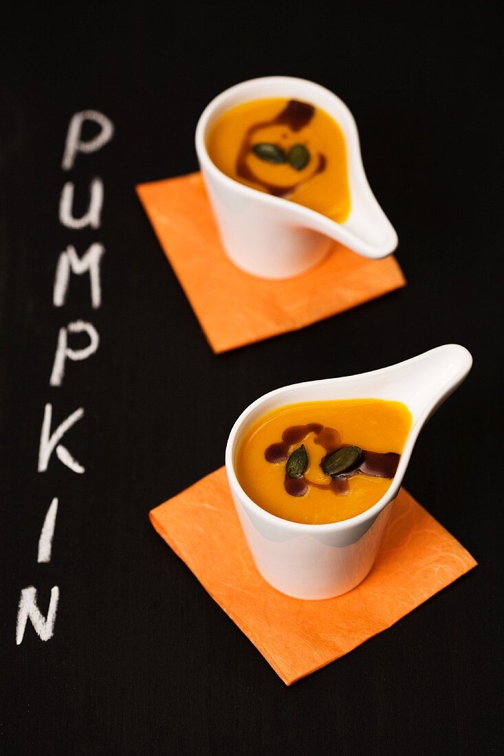 Cream of pumpkin soup in little bowls