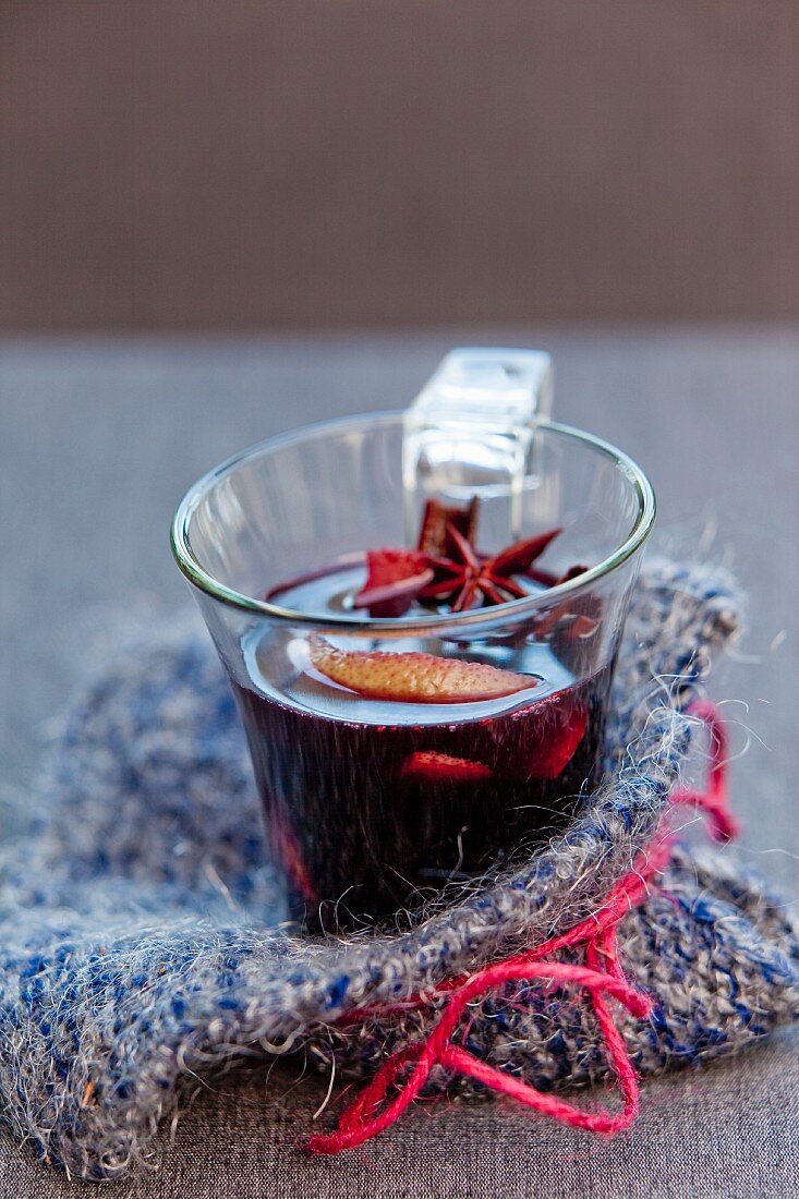 A glass of mulled wine with star anise