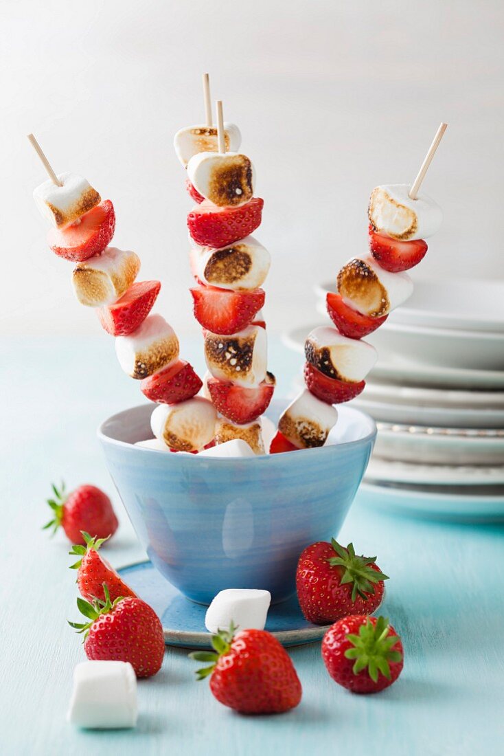 Marshmallow and strawberry skewers in bowl