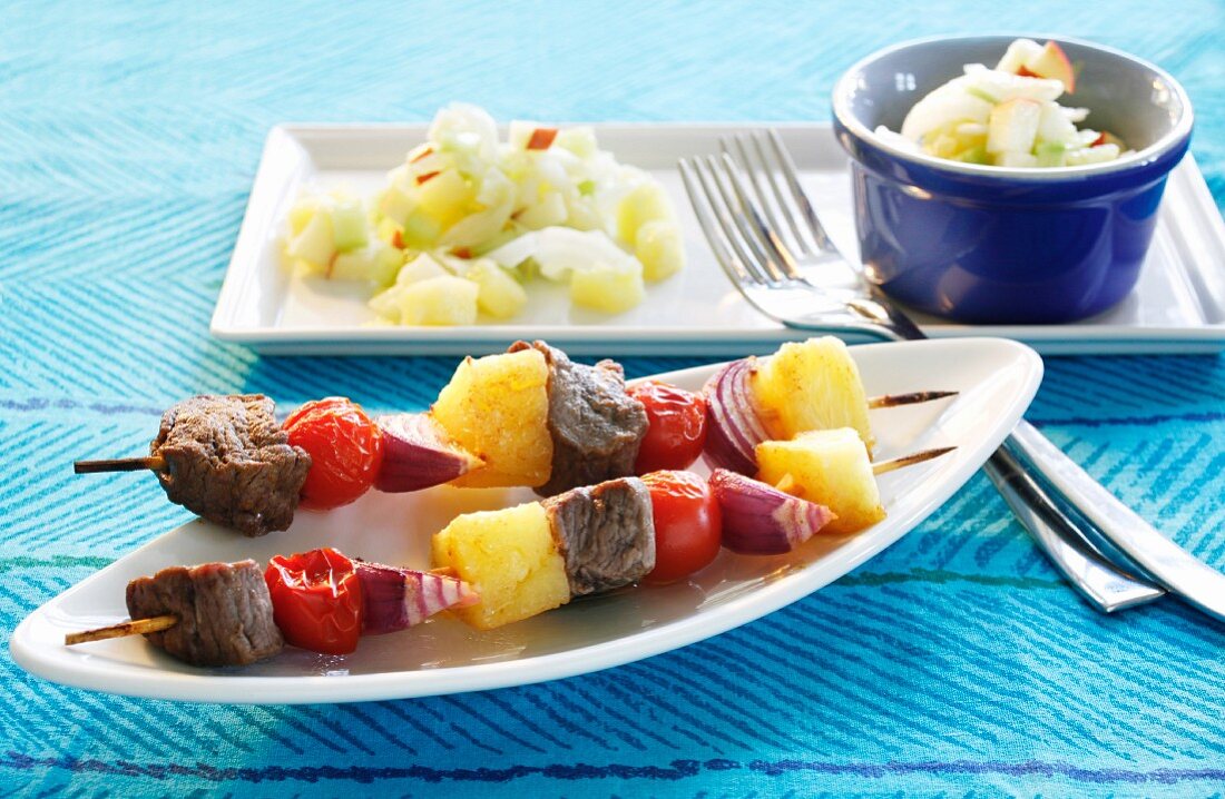 Barbecued pineapple kebabs and salad