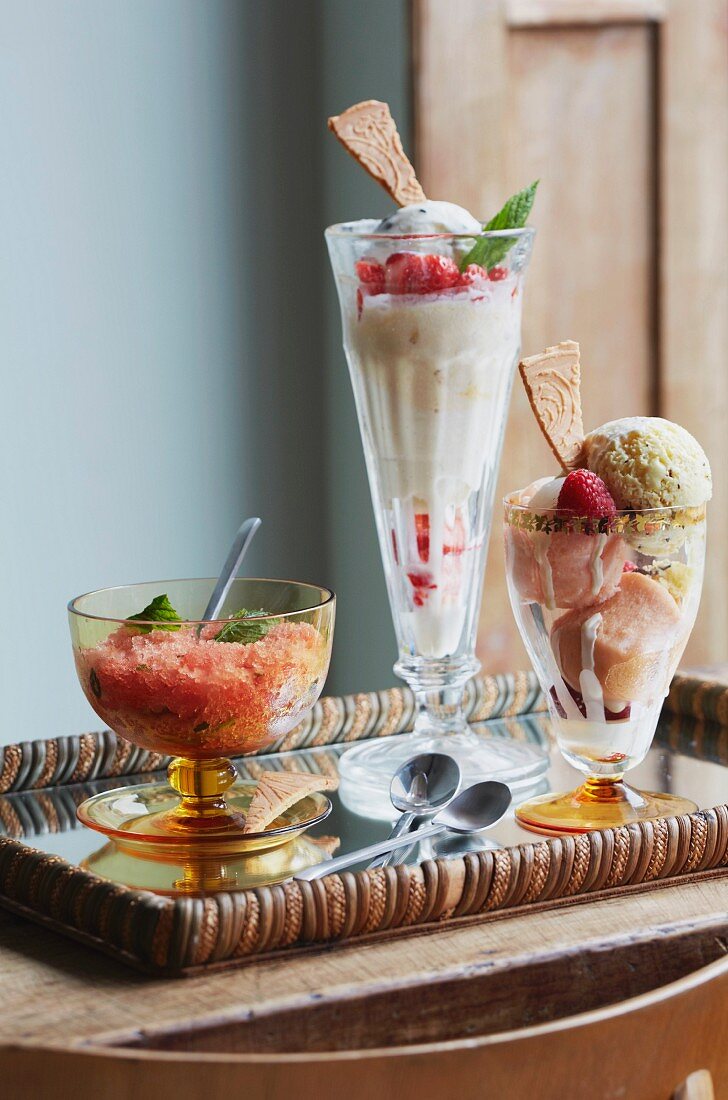 Two different ice cream sundaes and a sorbet