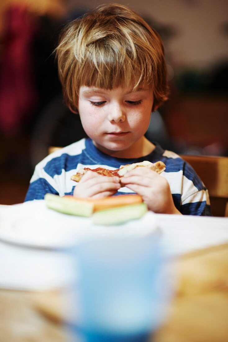 A boy eating a sandwich