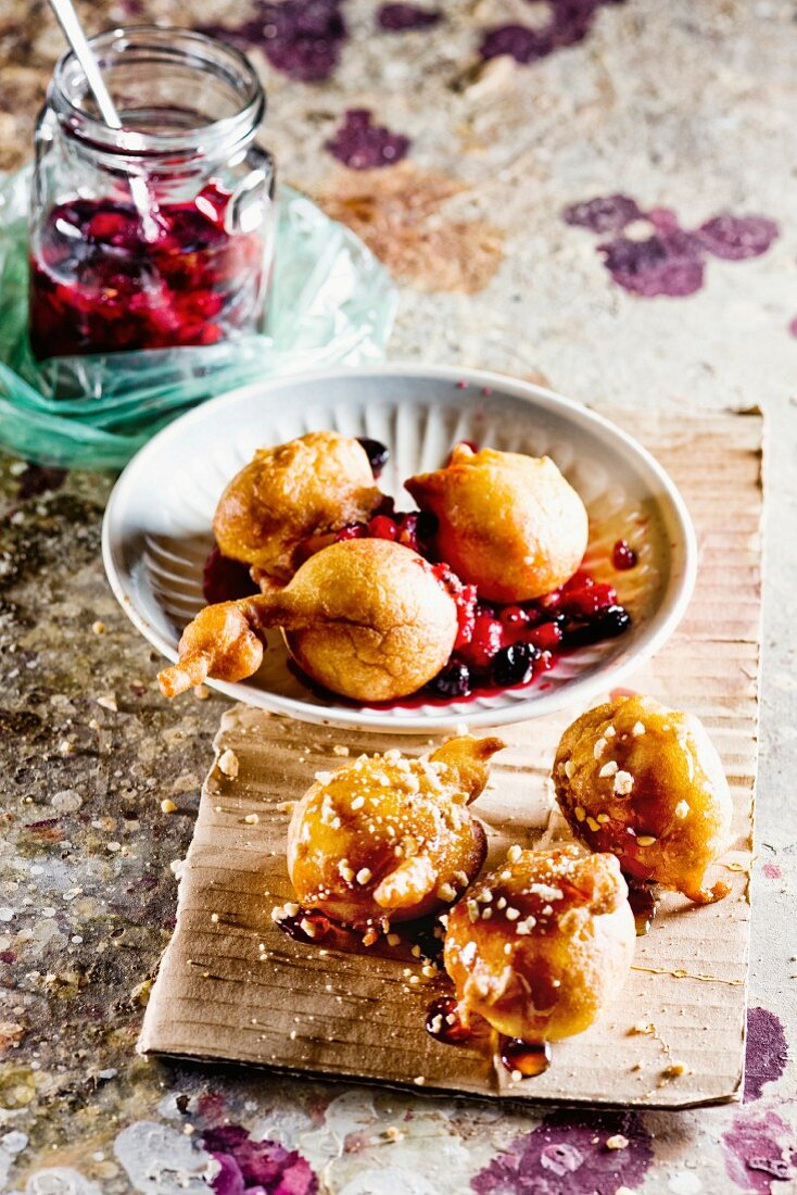 Banana doughnuts with berries and maple syrup