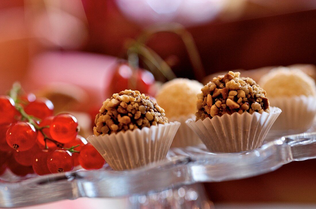 Filled chocolates covered with chopped nuts
