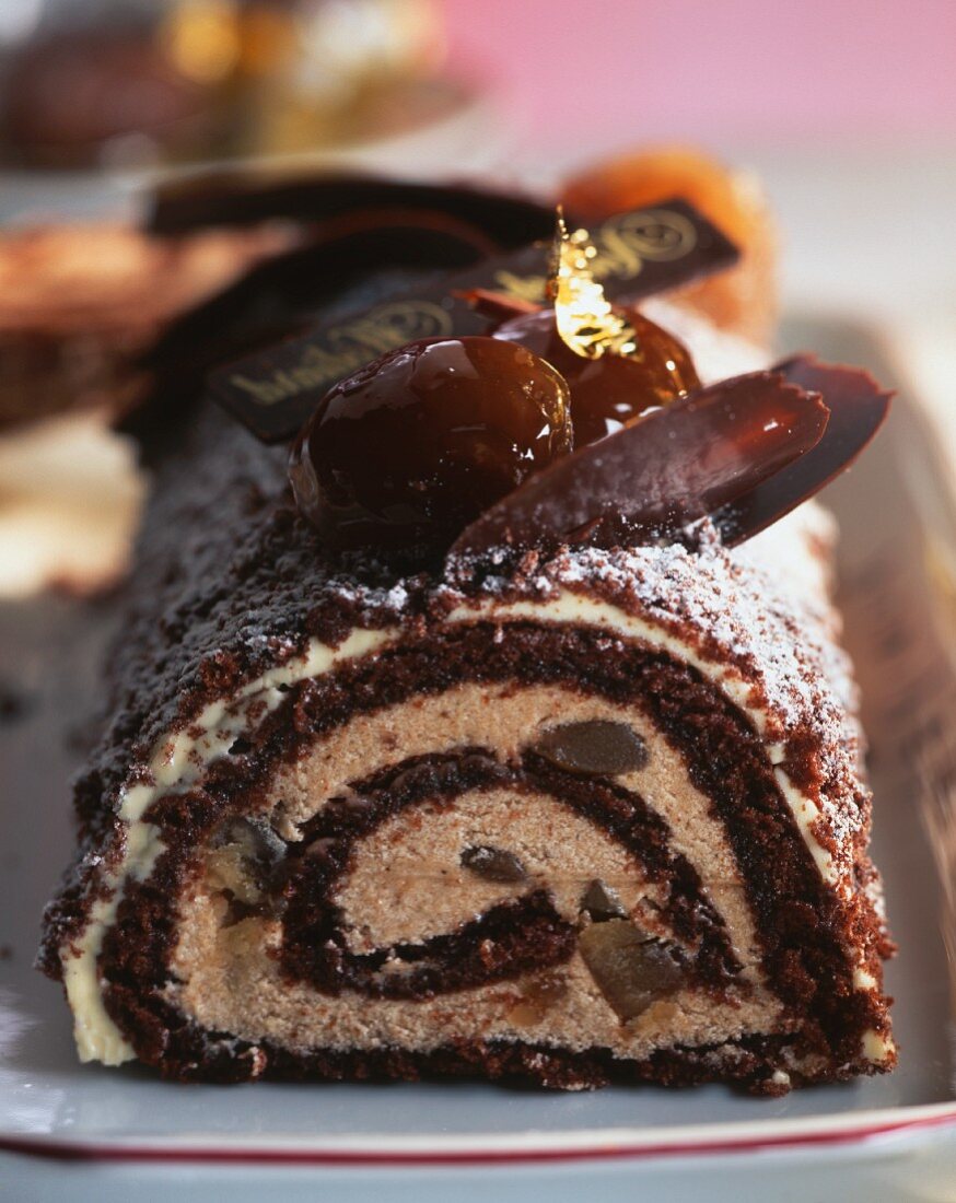A chocolate roulade with gold leaf for Christmas