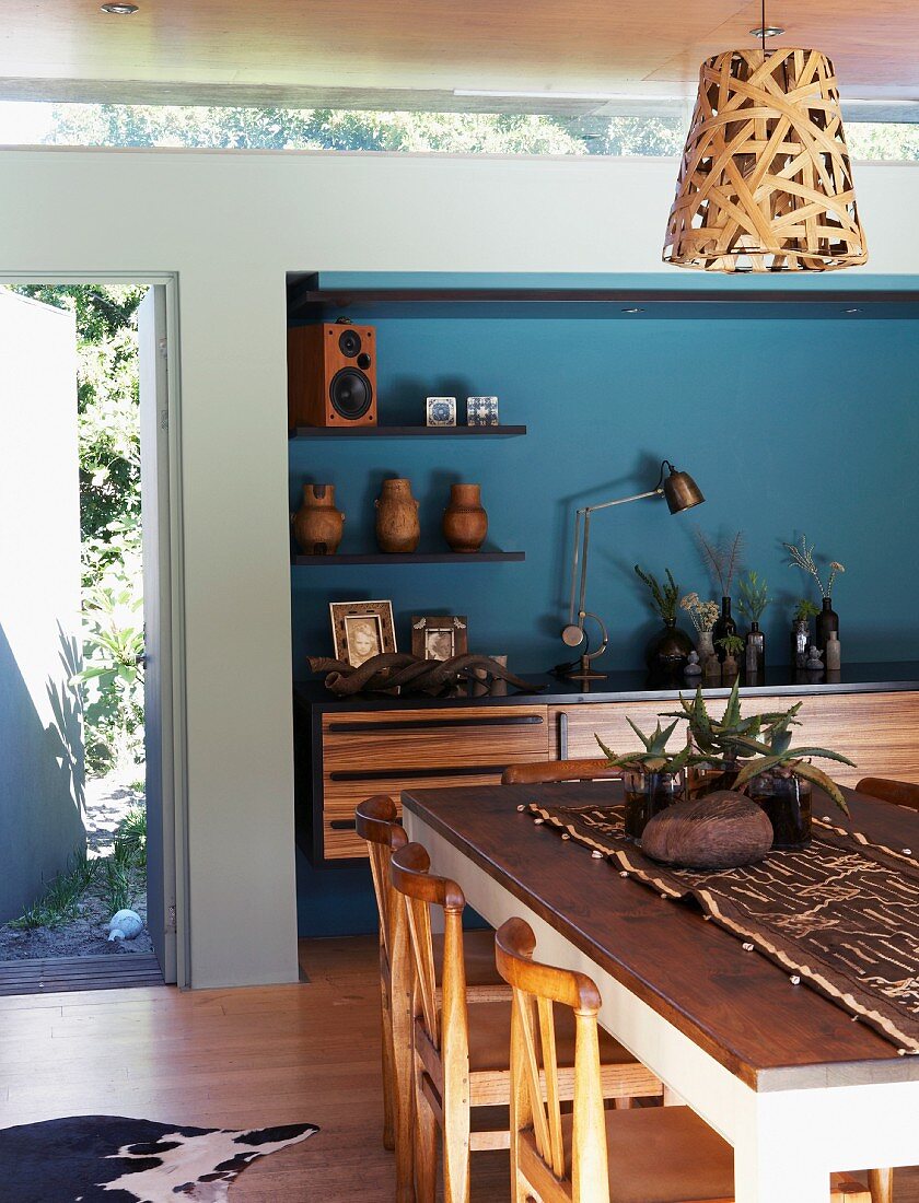 Interior with dining table & African-style decor