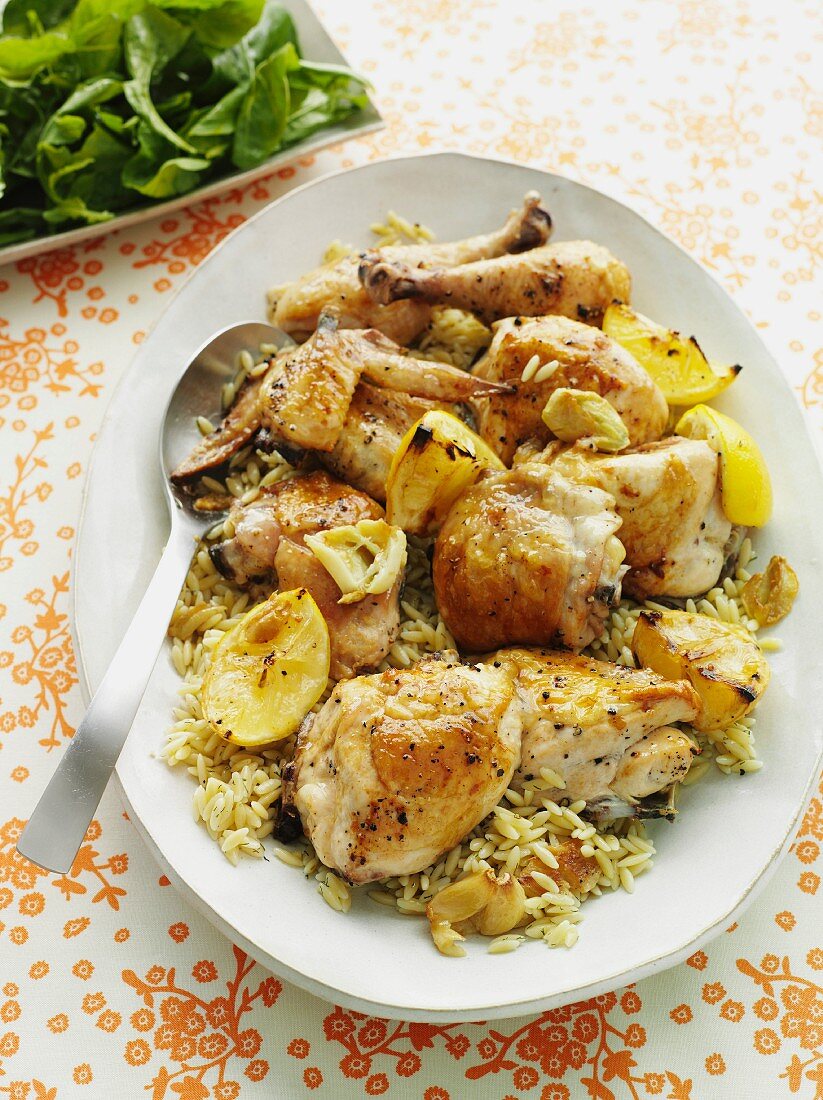 Lemon and curry chicken on rice-shaped pasta