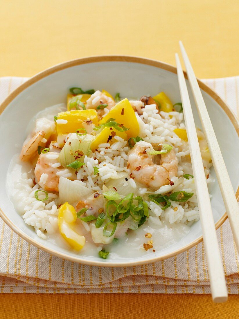 A dish of prawns, peppers and chilli with rice