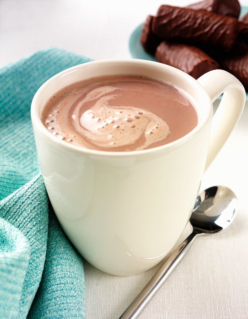 A mug of hot chocolate with chocolate biscuits