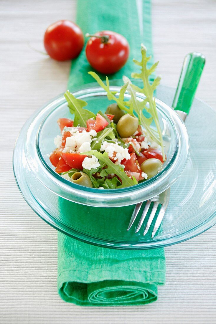 Tomato salad with rocket, olives and sheep's cheese