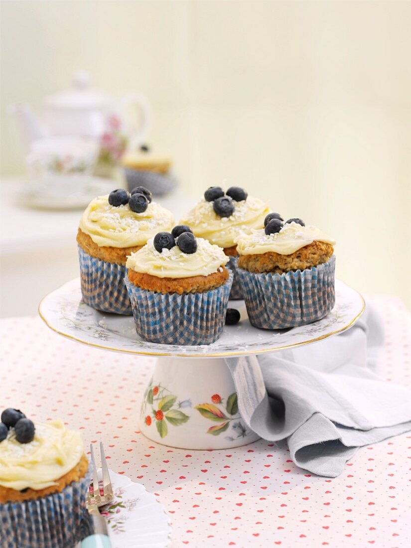 Banana cupcakes topped with blueberries