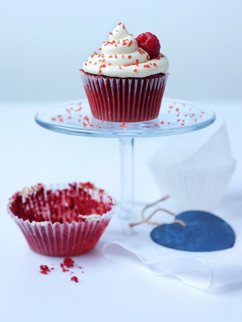 Raspberry cupcake on a cake stand