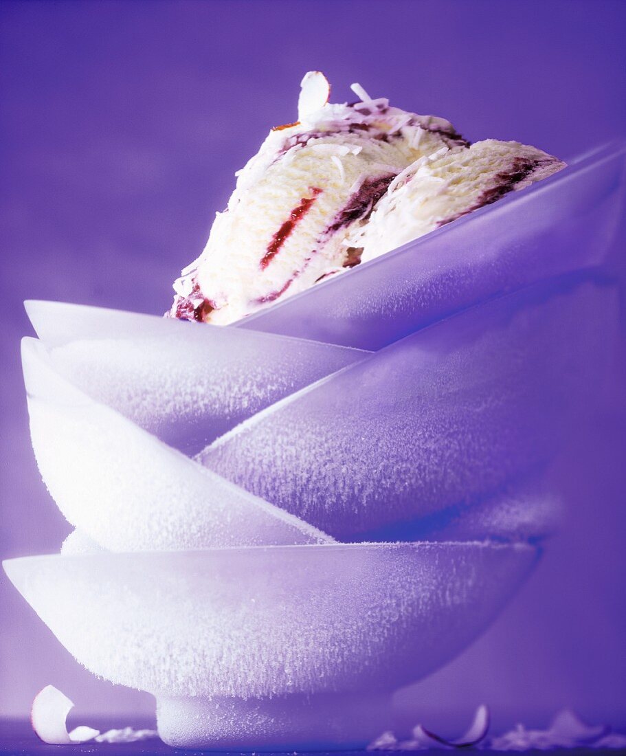 Coconut and elderberry ice cream in frozen dishes