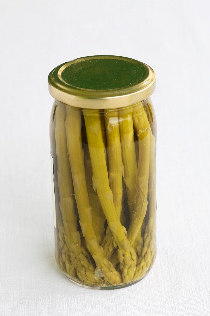 A jar of preserved green asparagus