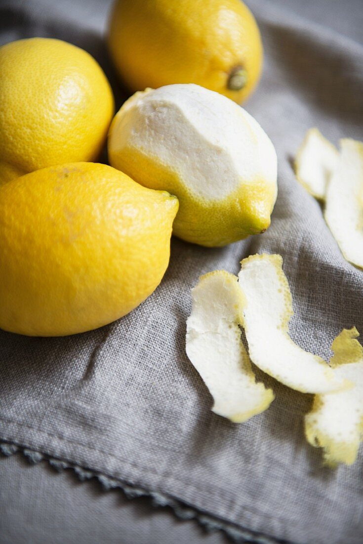 Lemons, whole and partially peeled