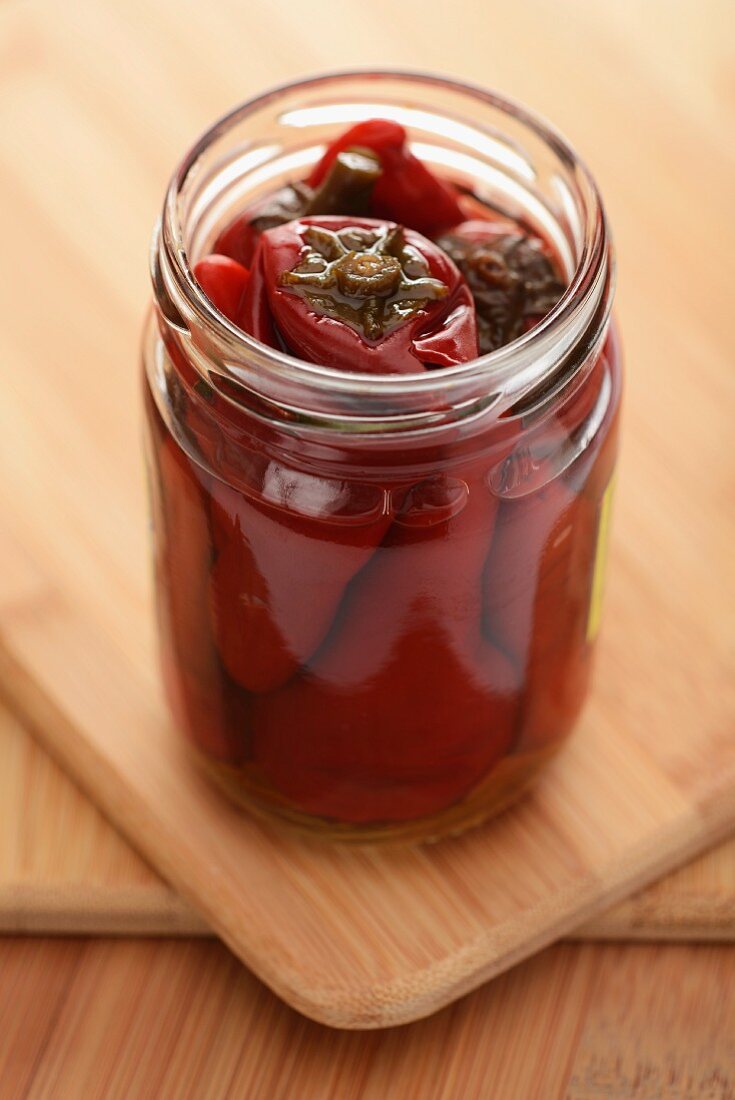 Pickled chillies in a screw-top jar