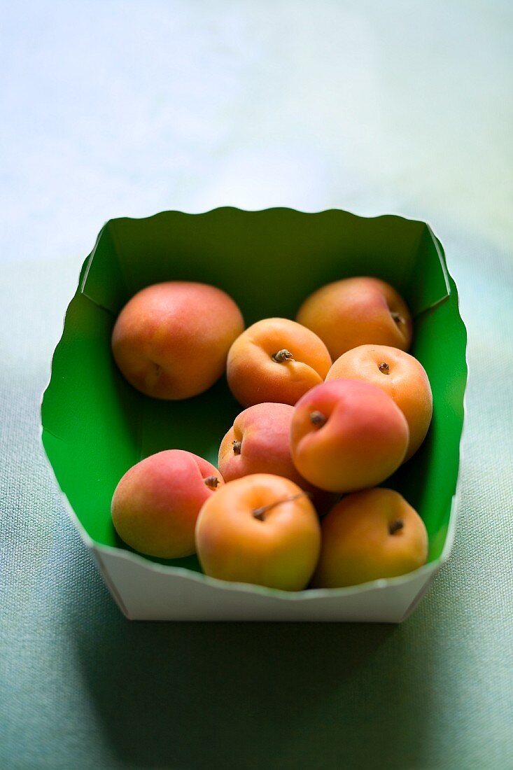 Fresh apricots in a cardboard box