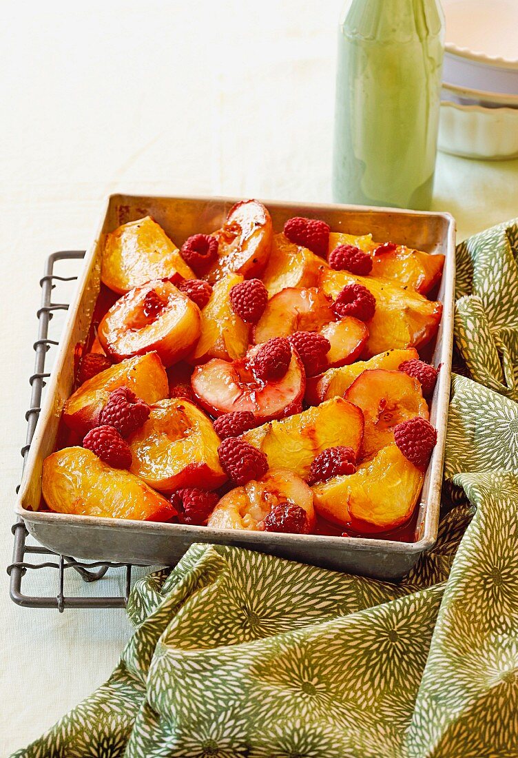 Baked peaches with raspberries