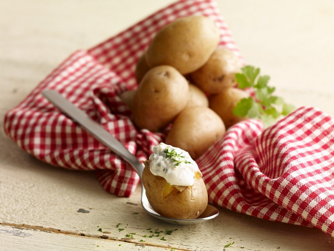 Oven-baked potatoes with herb dip