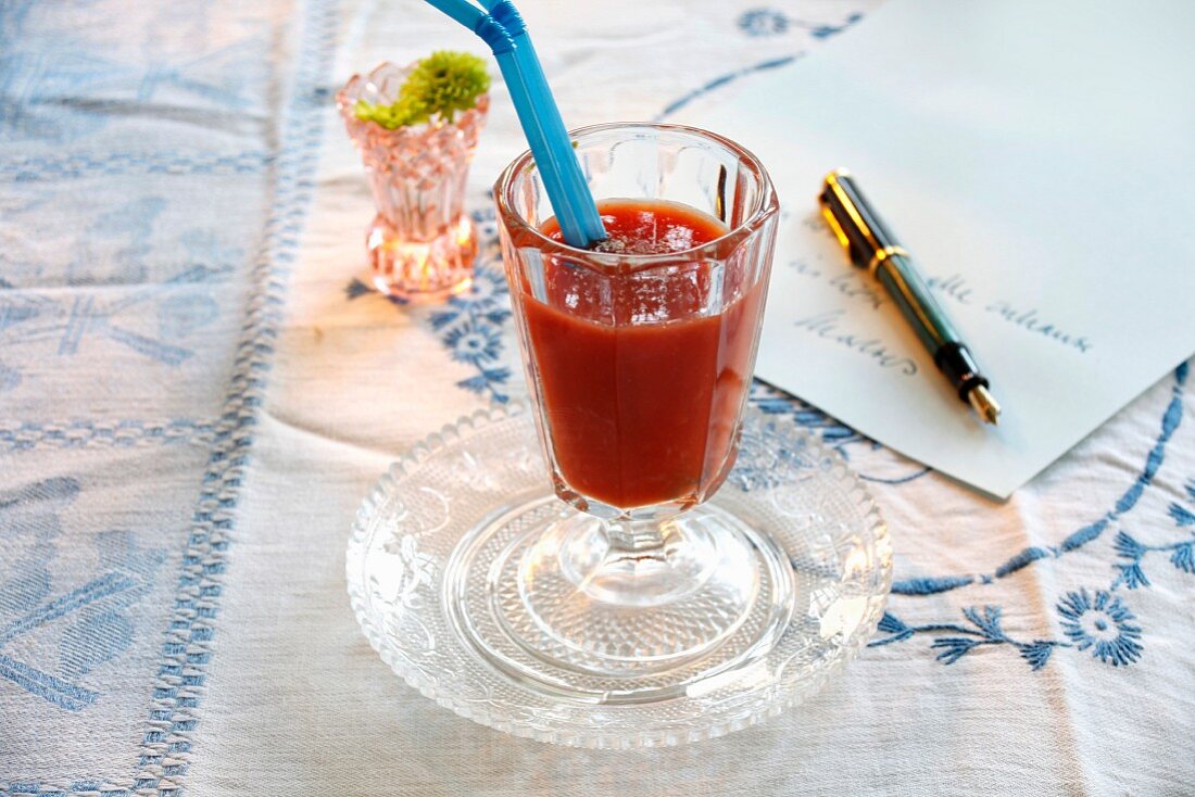 A tomato drink with peppers and blood oranges