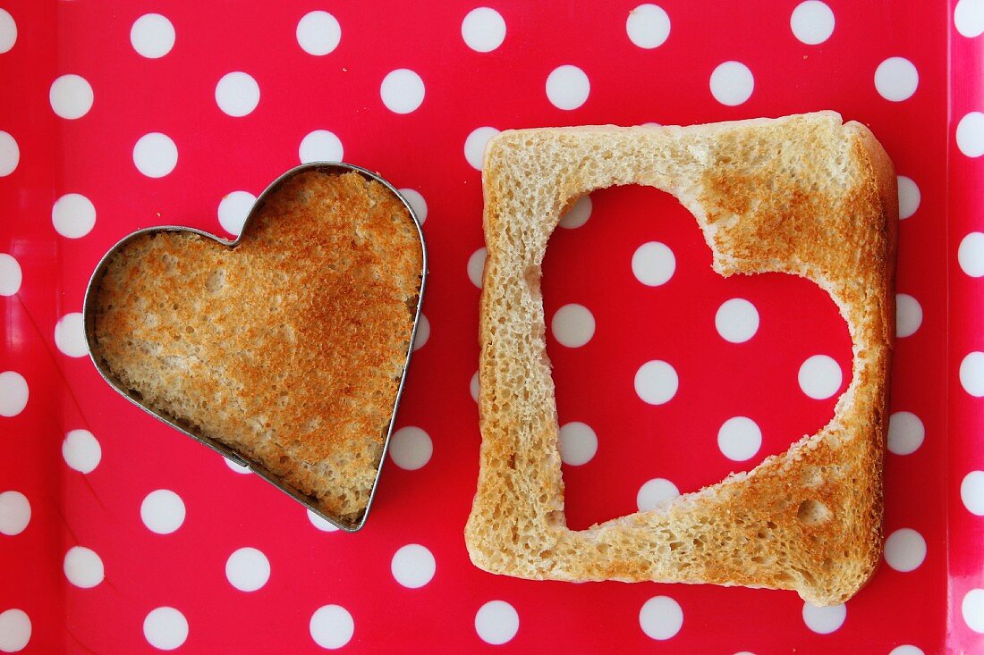 A heart cut out of a slice of toast