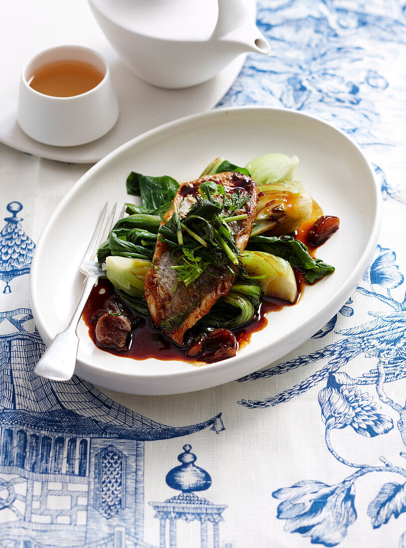 Fish in coconut-caramel sauce with bok choy (Vietnam)