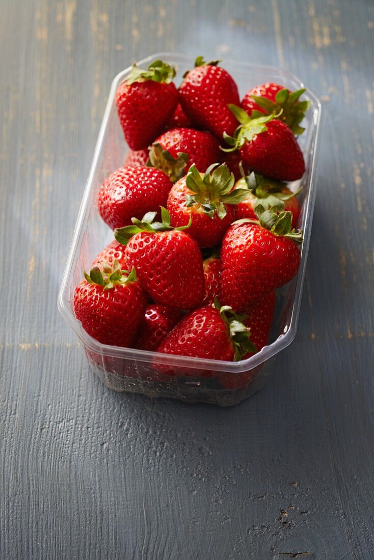 Fresh strawberries in a plastic punnet