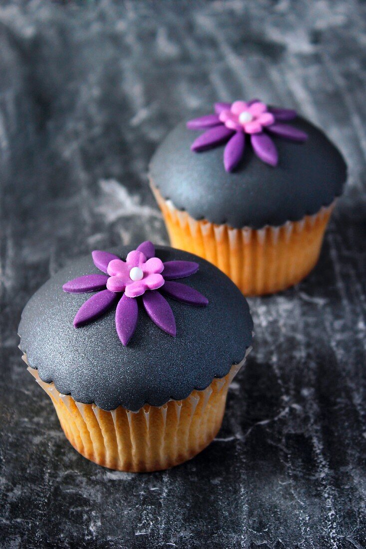 Vanilla cupcakes topped with grey fondant icing