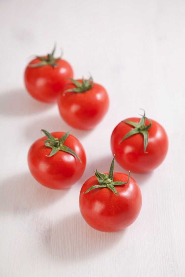 Five fresh tomatoes