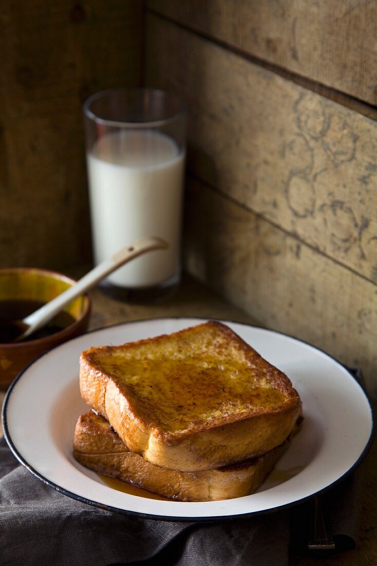 French toast with maple syrup and a glass of milk