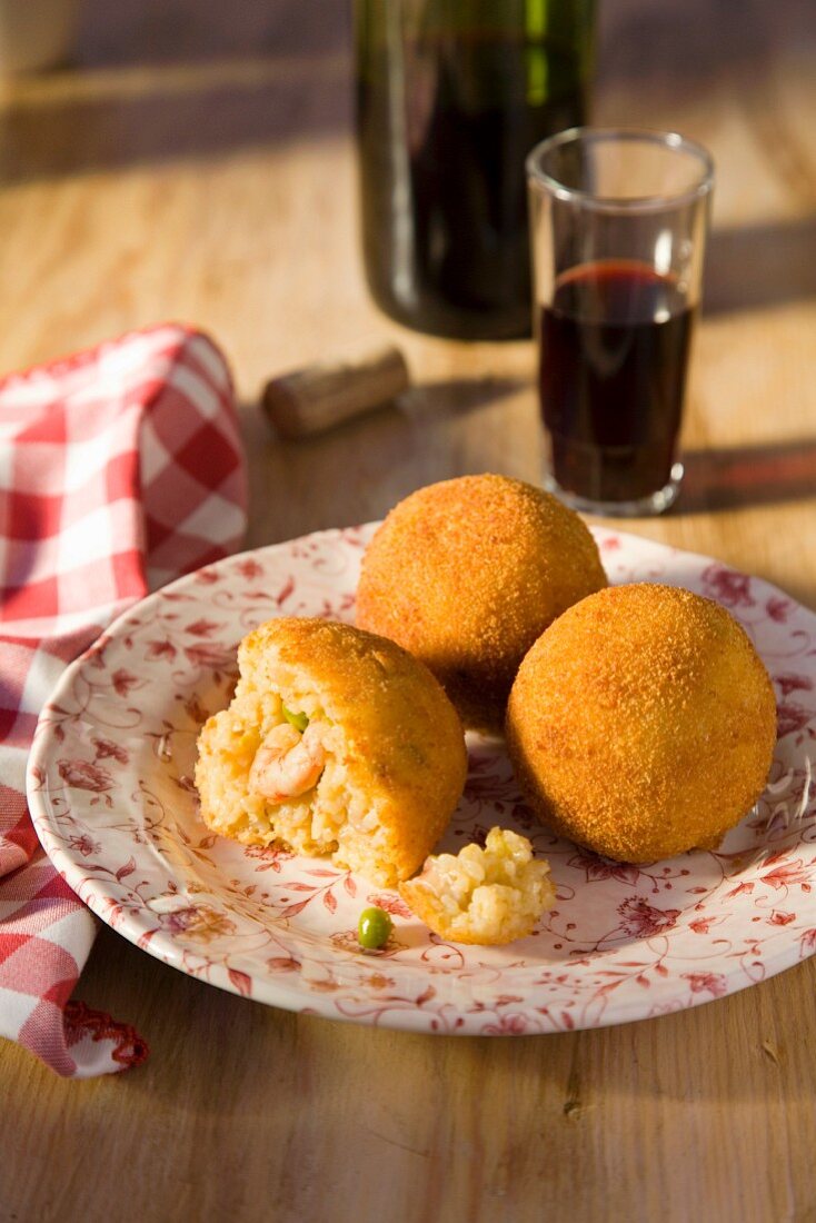 Arancini de paella (deep-fried rice balls with seafood, Spain)