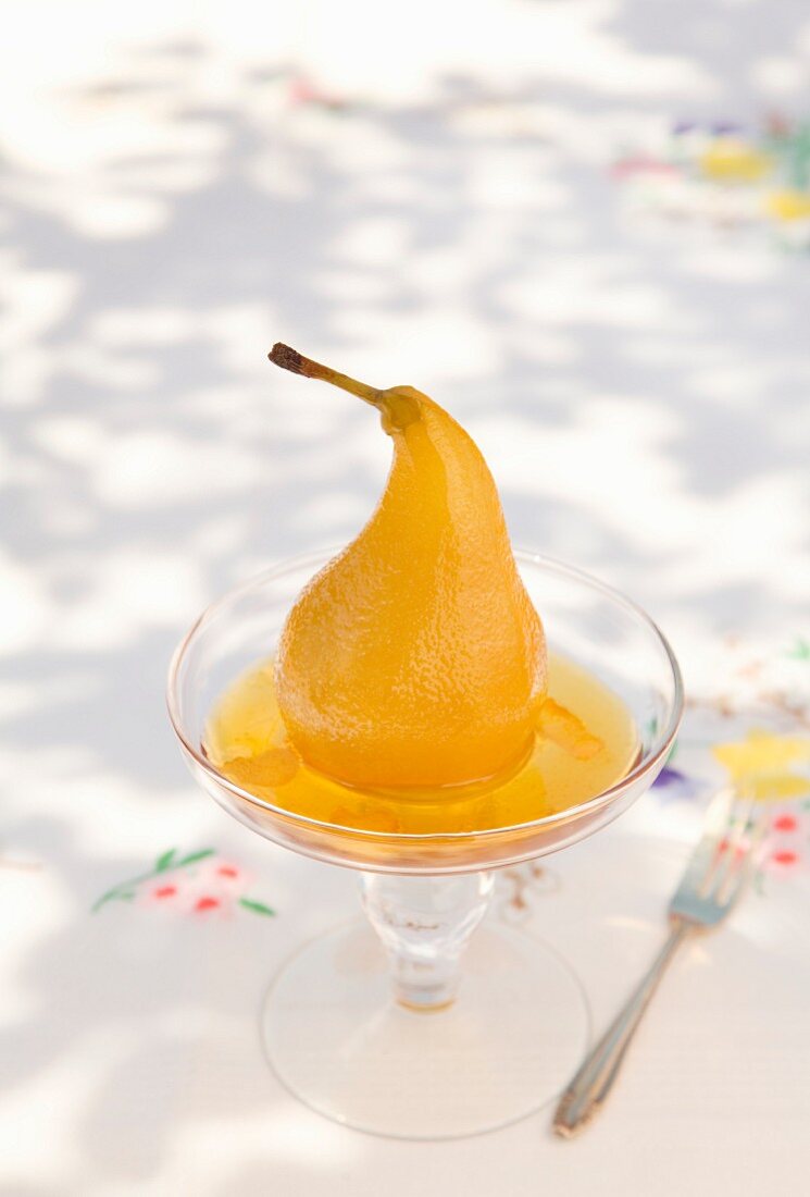 A pear poached in white wine