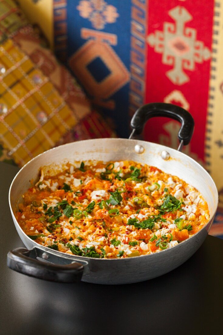 Menemen; Eggs Scrambled with Turkey, Feta, Tomatoes, Red and Green Peppers, Onions and Mushrooms in a Skillet