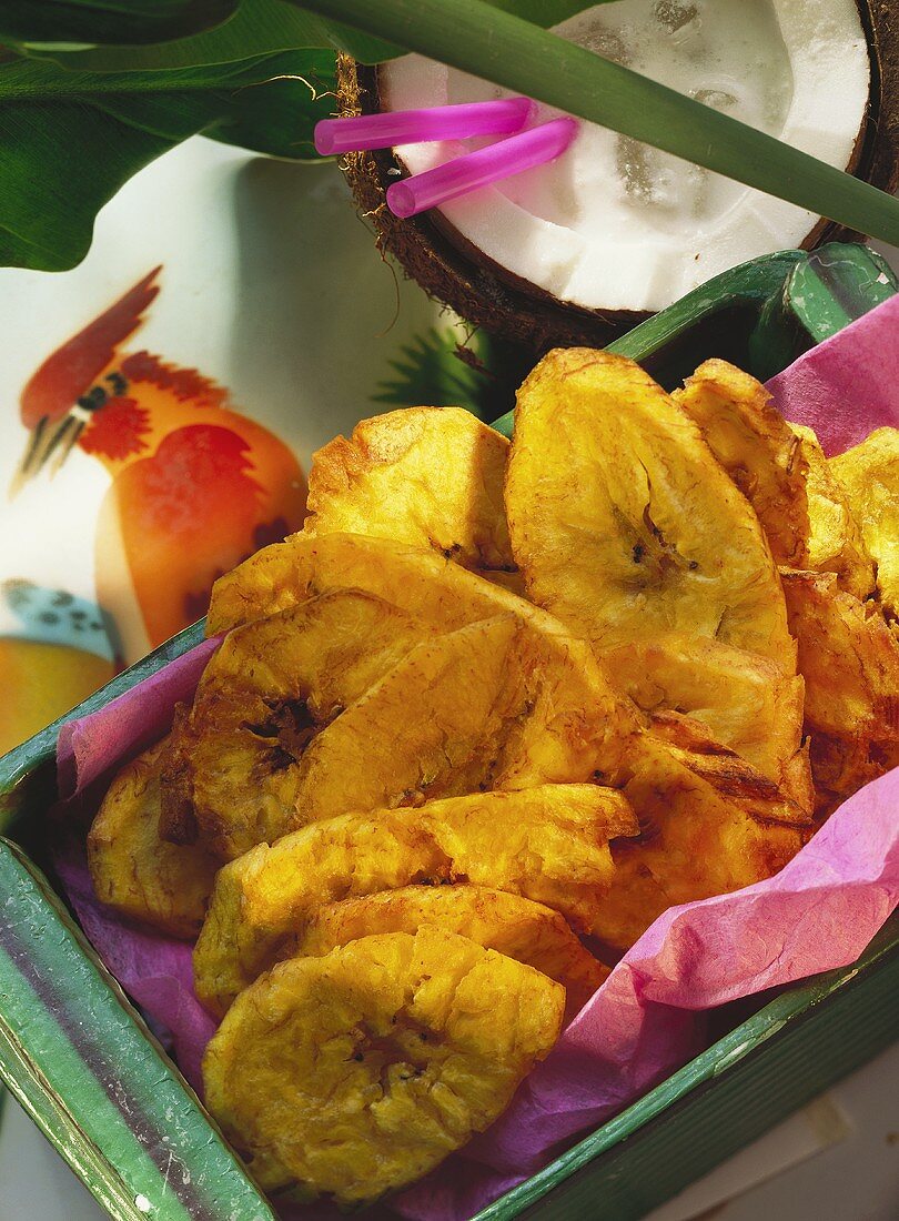 Deep-fried banana crisps; decoration: half coconut, leaves