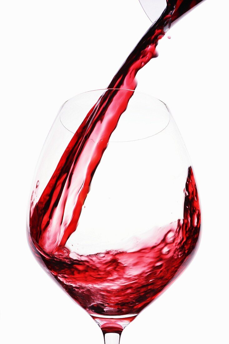 Red Wine being poured into glass
