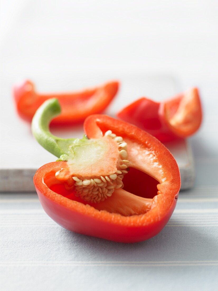 A red pepper, sliced open