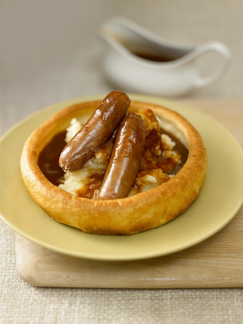 Bratwurst sausages with mashed potato and gravy