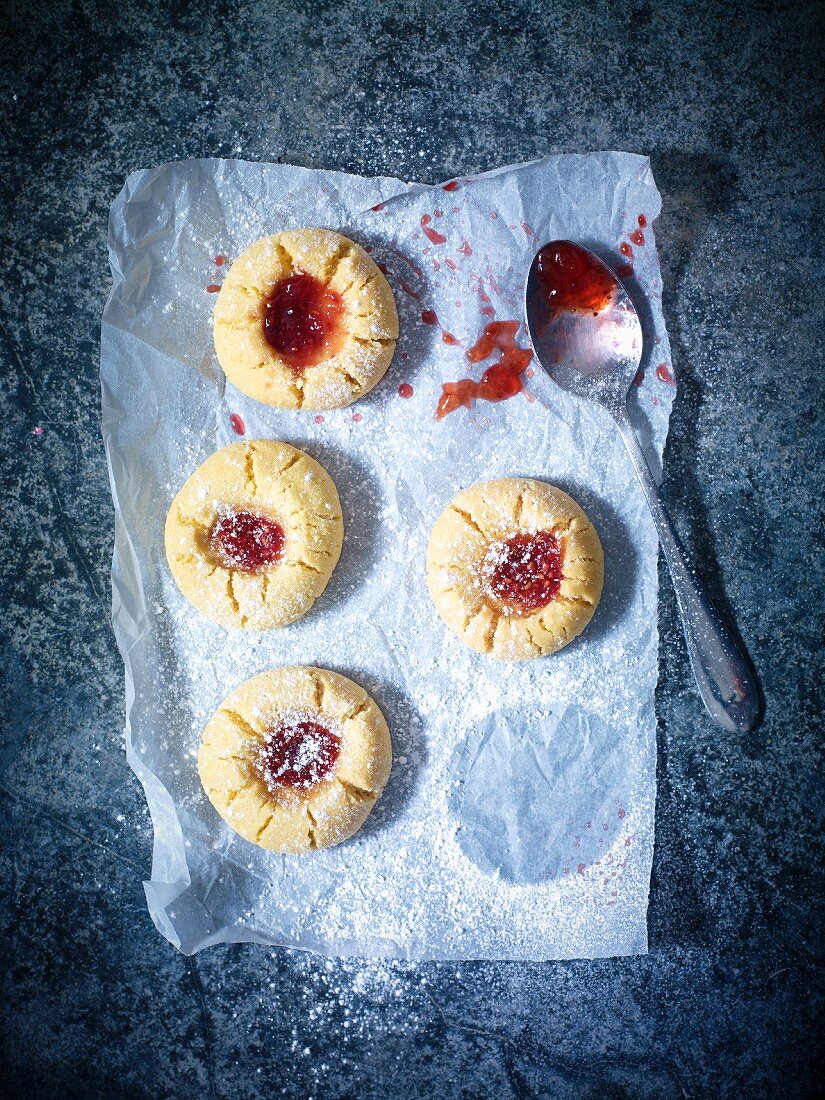 Husarenkrapfen (shortbread jam biscuits) on baking paper