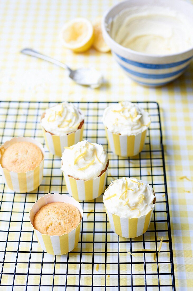 Lemon cupcakes on a cooling rack