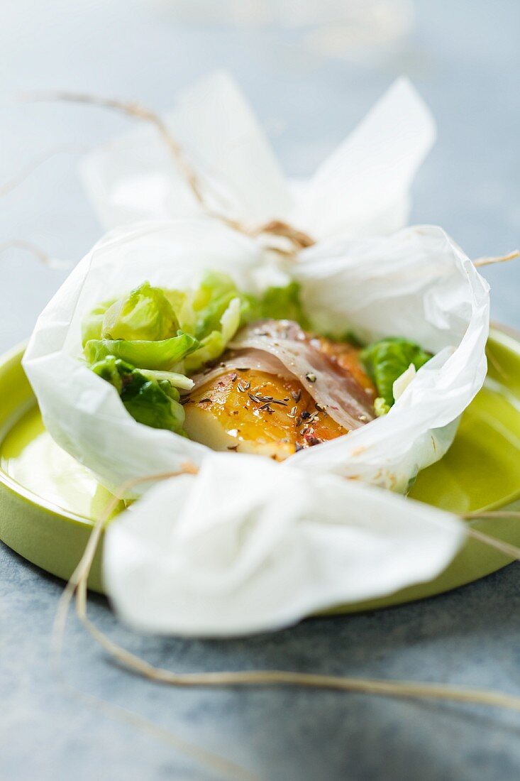 Haddock with bacon, wrapped in grease-proof paper