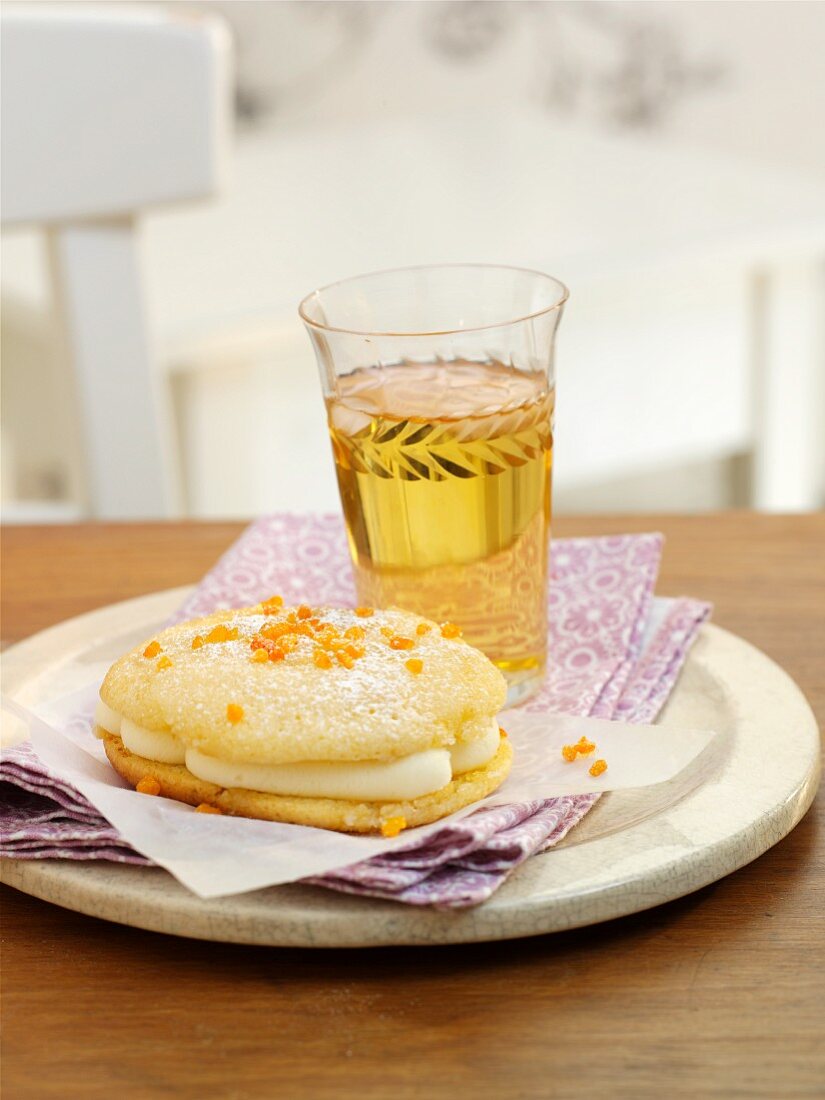 A whoopie pie with white chocolate and oranges