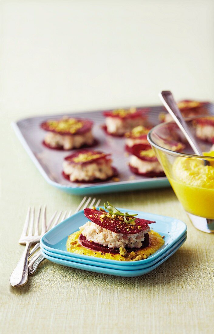 Beetroot ravioli with a cashew nut filling on a mango and pepper sauce