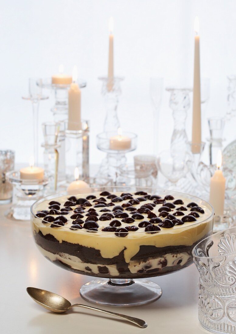 A Christmas chocolate trifle made with custard cream and cherries