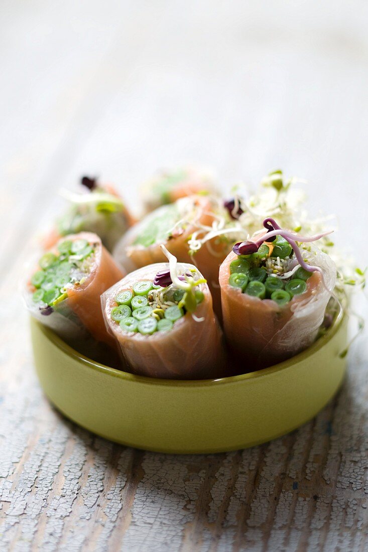 Smoked salmon rolls with green beans and sprouts