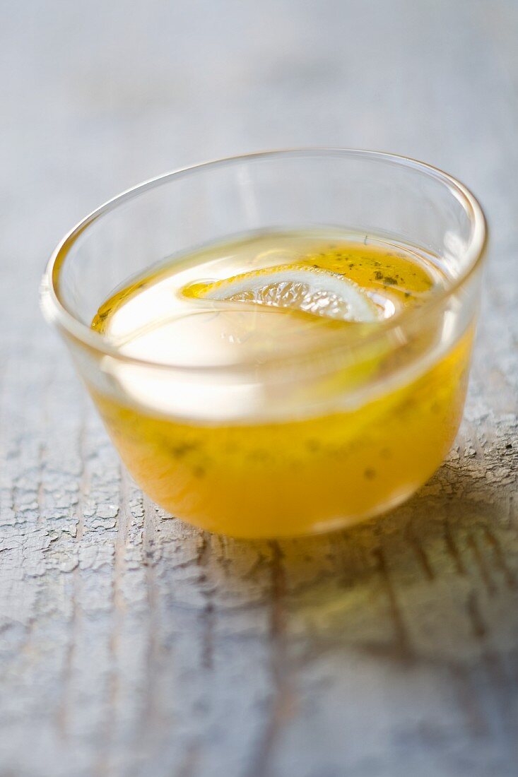 Lemon vinaigrette in a small glass bowl