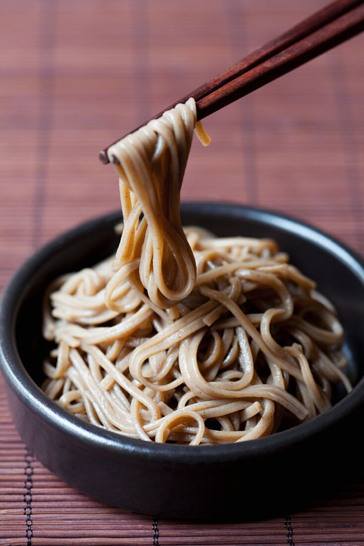 Cooked soba noodles with chopsticks