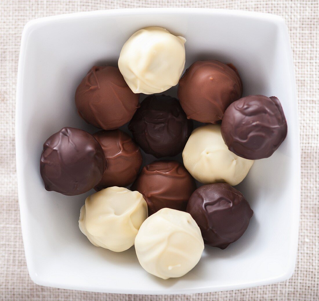 Assorted home-made chocolate truffles in a bowl