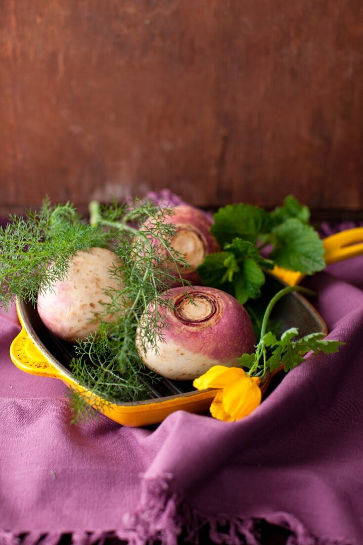 Fresh Whole Turnips with Fennel in a Yellow Skillet